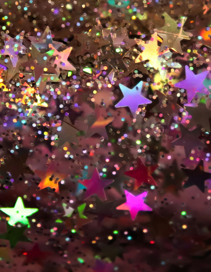 Alt="Photographie d'étoiles et de paillettes pour illustrer un article de blog"